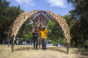 Two people underneath Star Dome, a fort art installation
